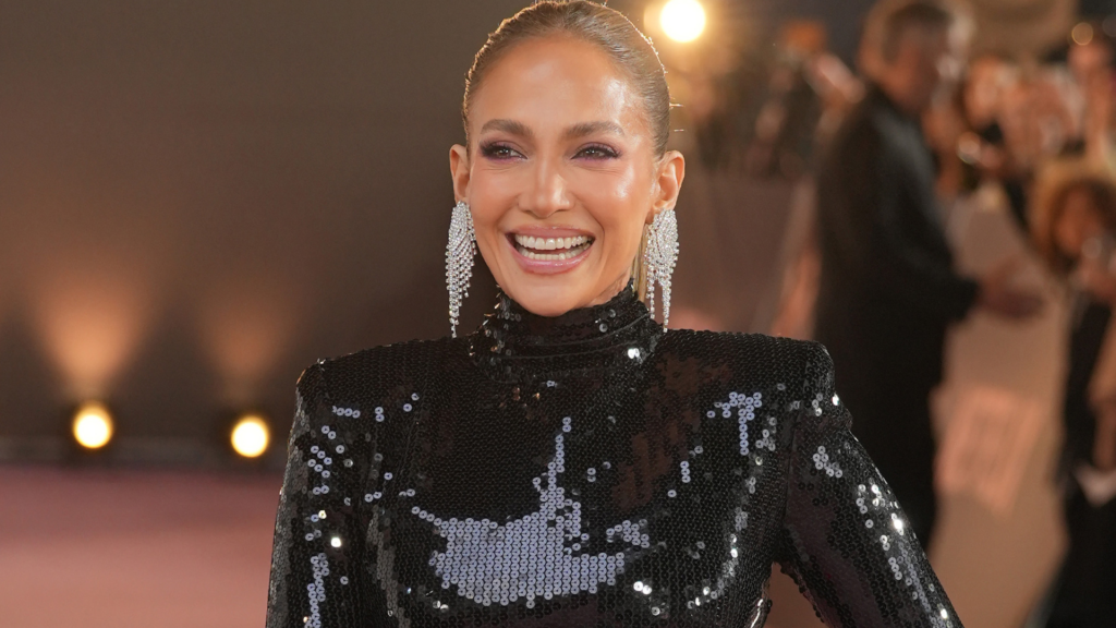 Jennifer Lopez wore a black sequin gown with a neon pink skirt at the Office Romance premiere in London