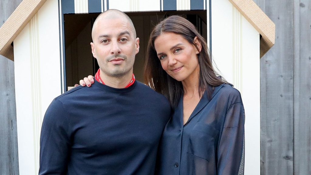 Katie Holmes and her new boyfriend attended Ferragamo in the Hamptons at Topping Rose House, the actress wore a sheer shirt and a fringed skirt